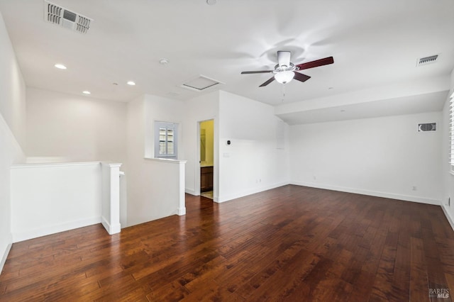 empty room featuring ceiling fan and dark hardwood / wood-style flooring