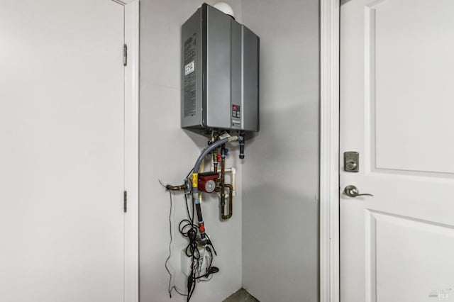 utility room featuring water heater