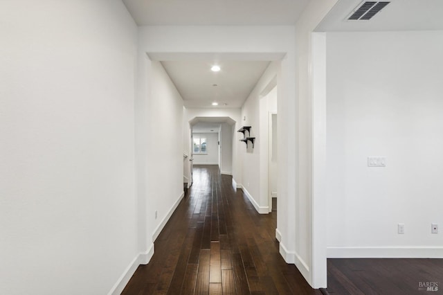 corridor featuring dark hardwood / wood-style floors