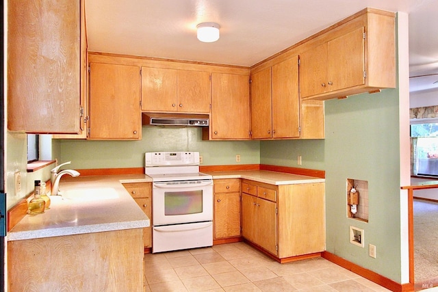 kitchen with white electric stove, light countertops, a sink, under cabinet range hood, and baseboards