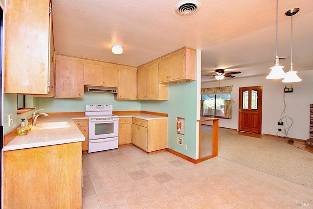 kitchen with under cabinet range hood, a sink, visible vents, light countertops, and white range with electric cooktop