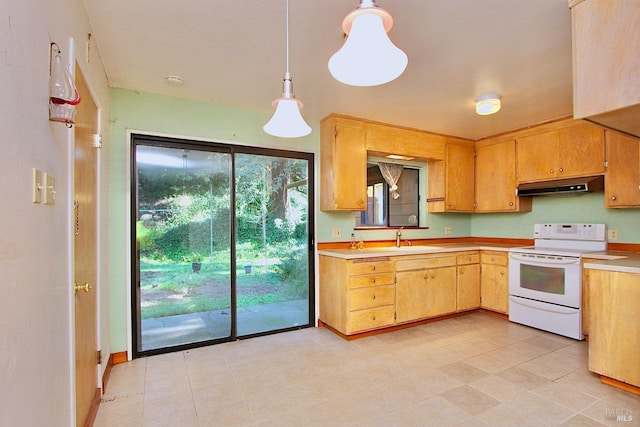 kitchen with under cabinet range hood, a sink, light countertops, hanging light fixtures, and white range with electric stovetop