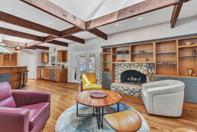 living room with a stone fireplace, baseboards, french doors, light wood-type flooring, and beamed ceiling