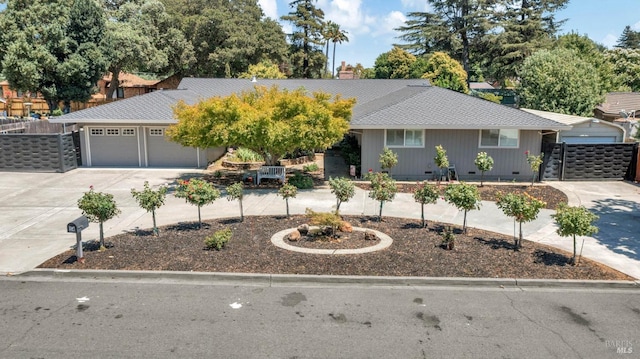 ranch-style home with crawl space, driveway, an attached garage, and roof with shingles