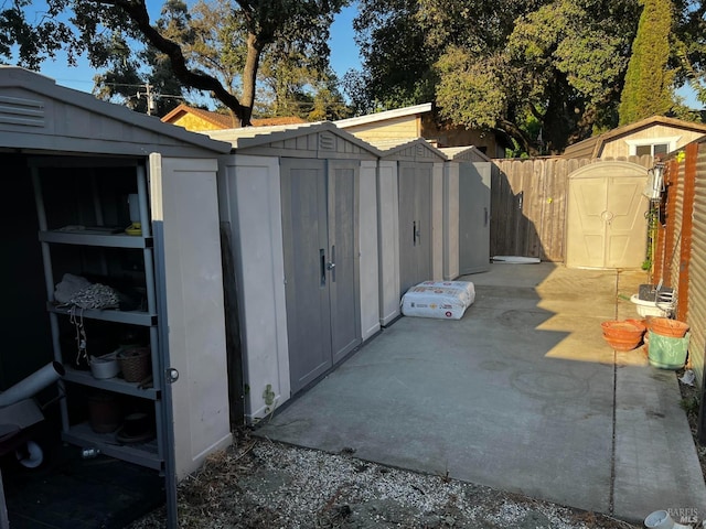 view of shed with fence