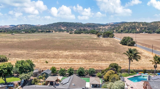 drone / aerial view with a rural view and a mountain view