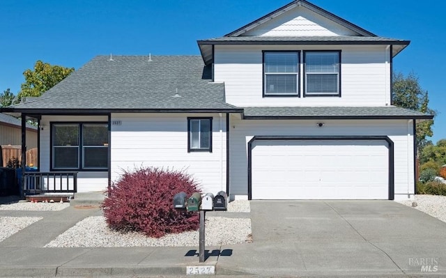 front of property featuring a porch and a garage