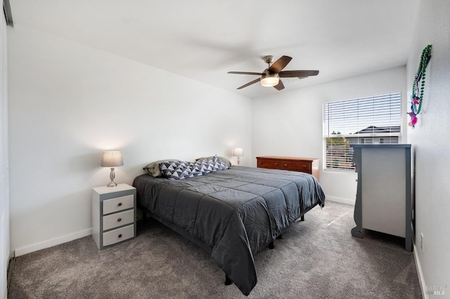 bedroom featuring dark carpet and ceiling fan