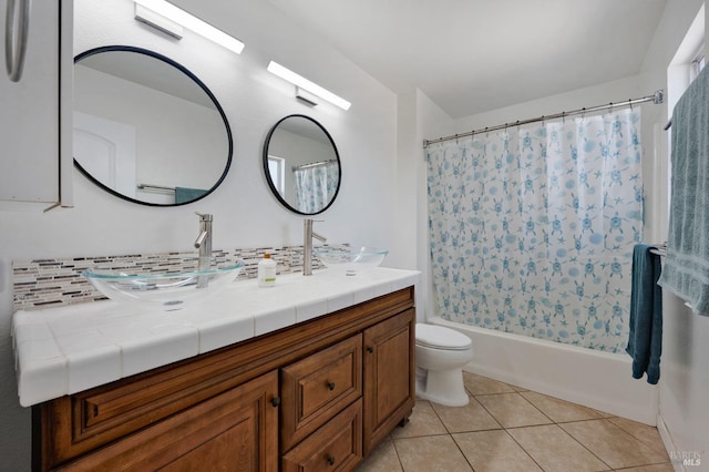 full bathroom featuring tile patterned floors, toilet, vanity, shower / bathtub combination with curtain, and decorative backsplash