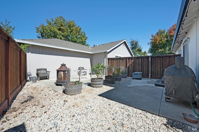 view of patio / terrace featuring a fire pit