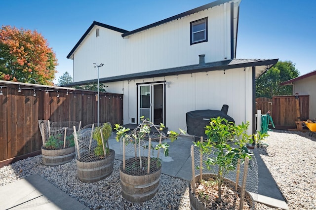 back of property featuring a patio area