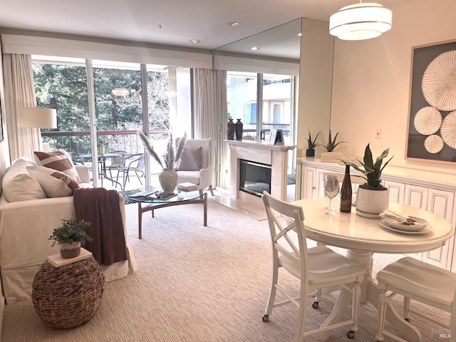 interior space featuring light carpet and a fireplace