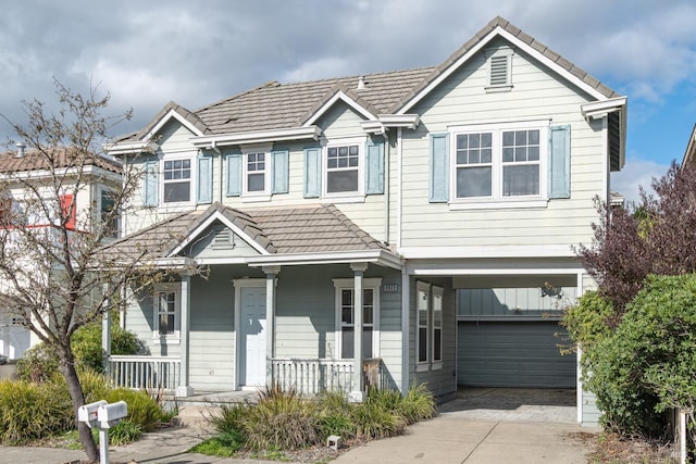 view of front of property featuring a garage and a porch