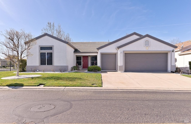 ranch-style house featuring a garage, concrete driveway, fence, a front yard, and stucco siding