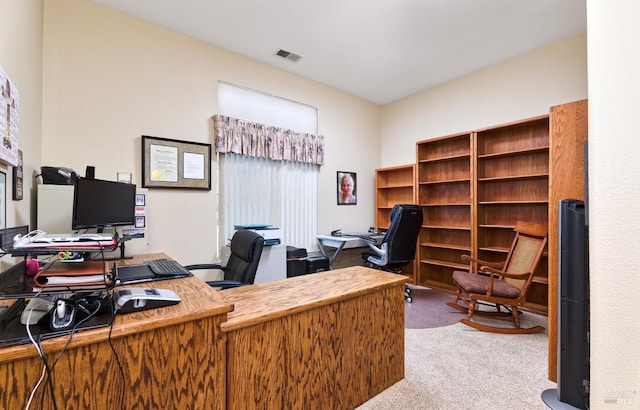 carpeted office space with visible vents