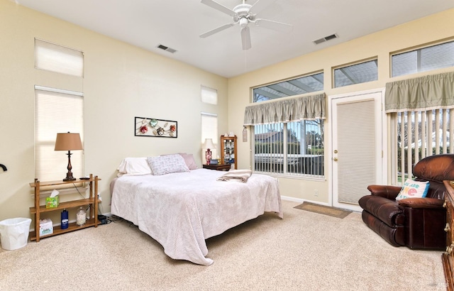 bedroom with ceiling fan, carpet, visible vents, and access to exterior