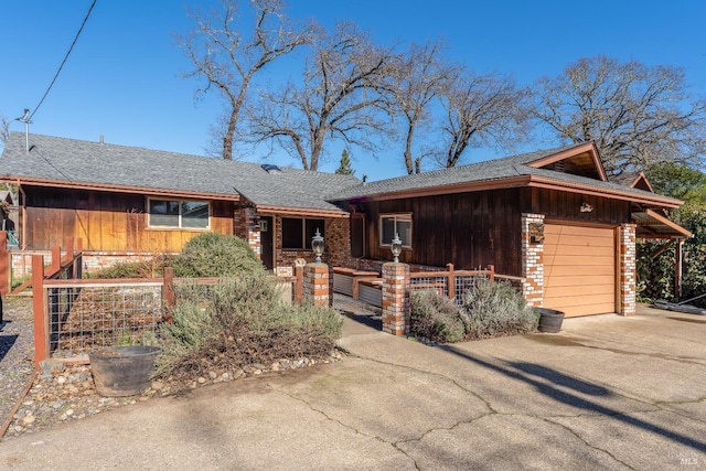 ranch-style house featuring a garage