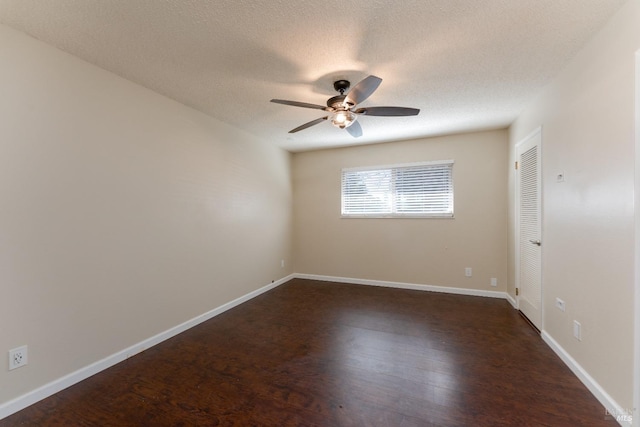 unfurnished room featuring ceiling fan, dark hardwood / wood-style floors, and a textured ceiling