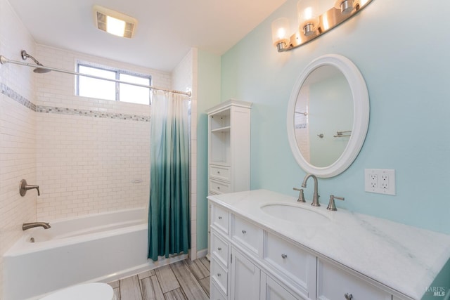 bathroom featuring shower / bathtub combination with curtain and vanity