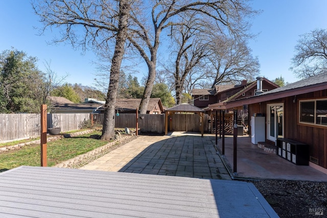 wooden deck with a patio area