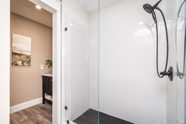 1061 Steele Canyon Rd, Napa, CA 94558 - bathroom featuring tiled shower, vanity, baseboards, and wood finished floors