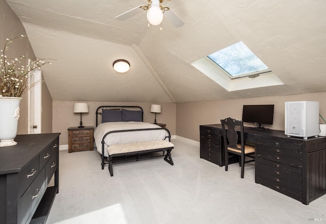 1061 Steele Canyon Rd, Napa, CA 94558 - bedroom with vaulted ceiling with skylight, carpet, baseboards, and a ceiling fan