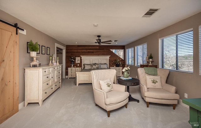 1061 Steele Canyon Rd, Napa, CA 94558 - bedroom featuring light colored carpet, visible vents, wooden walls, and a barn door