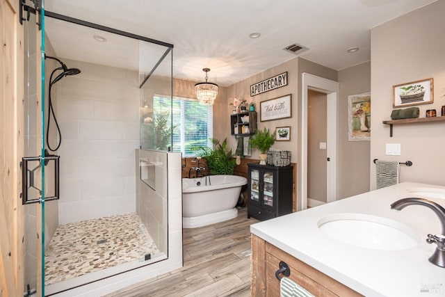 1061 Steele Canyon Rd, Napa, CA 94558 - bathroom featuring a freestanding tub, wood finish floors, vanity, visible vents, and a stall shower