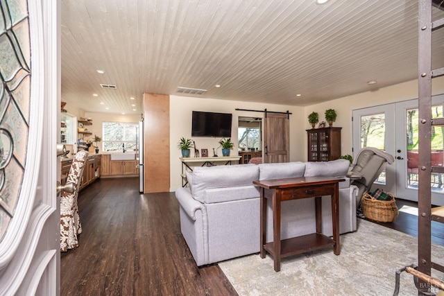 1061 Steele Canyon Rd, Napa, CA 94558 - living area with wood ceiling, visible vents, dark wood finished floors, and a barn door