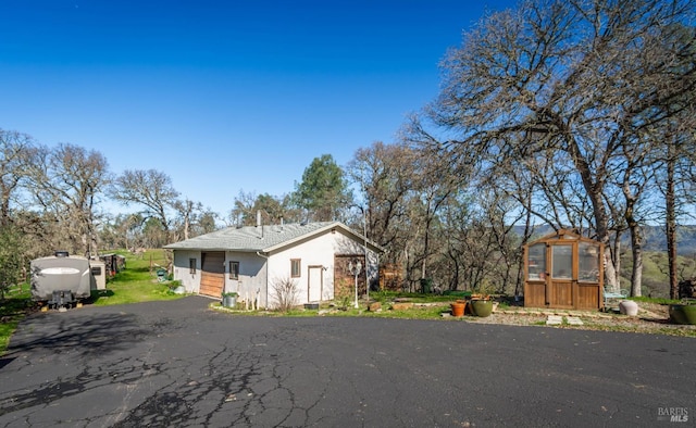 1061 Steele Canyon Rd, Napa, CA 94558 - view of home's exterior featuring driveway, an outdoor structure, and an exterior structure