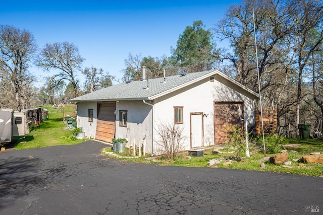 1061 Steele Canyon Rd, Napa, CA 94558 - view of front of home featuring aphalt driveway, a shingled roof, an attached garage, and stucco siding