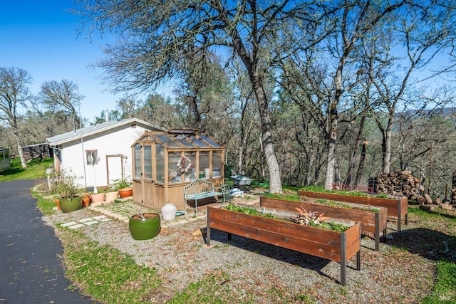 1061 Steele Canyon Rd, Napa, CA 94558 - view of yard featuring a greenhouse, a vegetable garden, and an outdoor structure