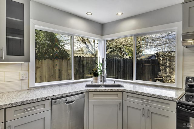 kitchen with sink, gray cabinetry, black electric range, plenty of natural light, and dishwasher