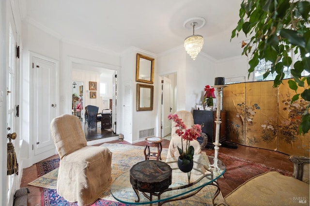 living room featuring ornamental molding and a chandelier