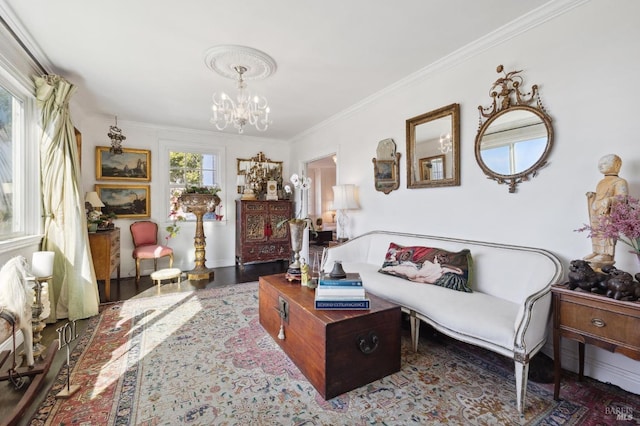 living room featuring dark hardwood / wood-style flooring, ornamental molding, and a chandelier