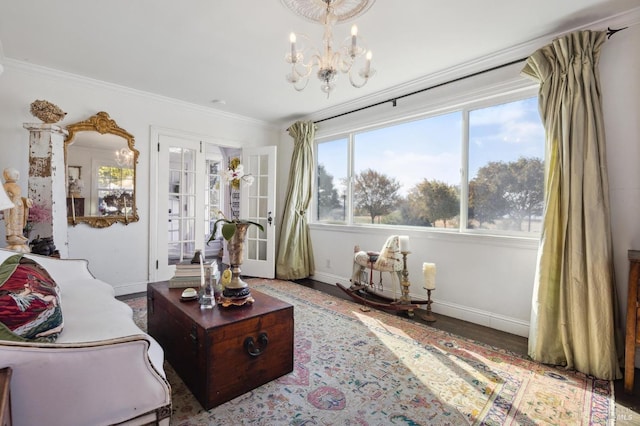 living room featuring crown molding, a chandelier, and hardwood / wood-style flooring