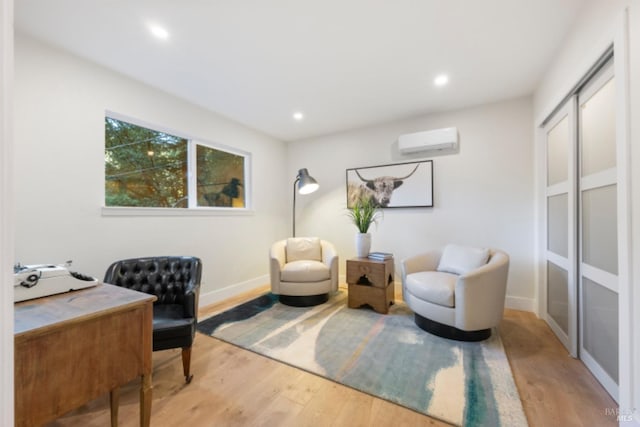 office space featuring hardwood / wood-style flooring and an AC wall unit