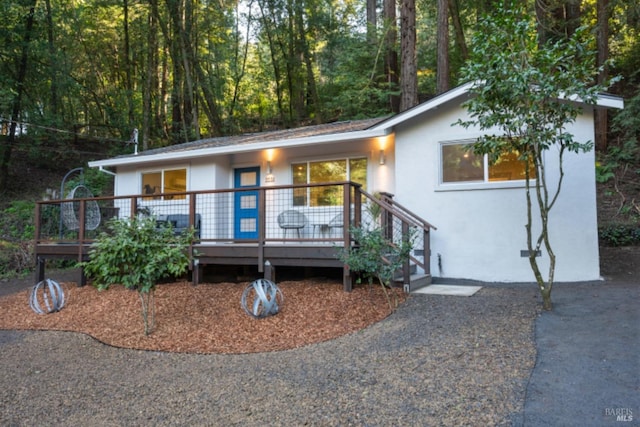 view of front of property with a wooden deck