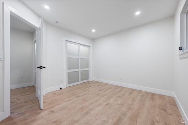 unfurnished room with light wood-type flooring