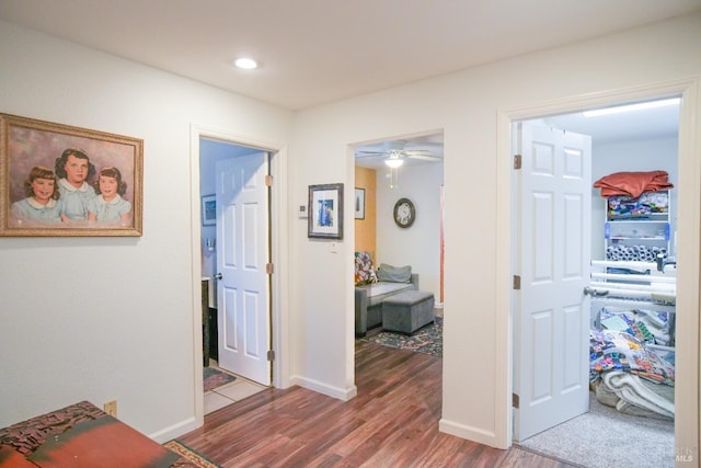 hallway featuring wood-type flooring