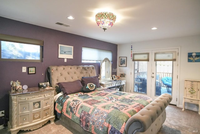 carpeted bedroom with multiple windows, access to exterior, and french doors