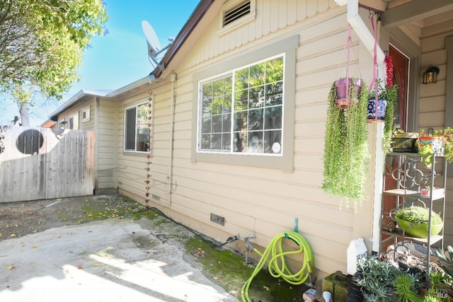 view of side of home with a patio area