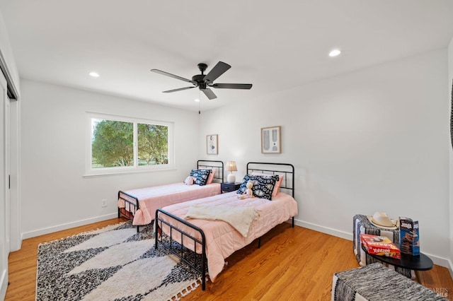 bedroom featuring light wood-type flooring and baseboards