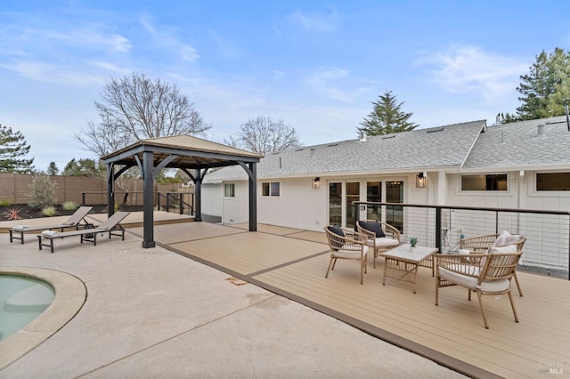 exterior space featuring fence, an outdoor living space, and a gazebo