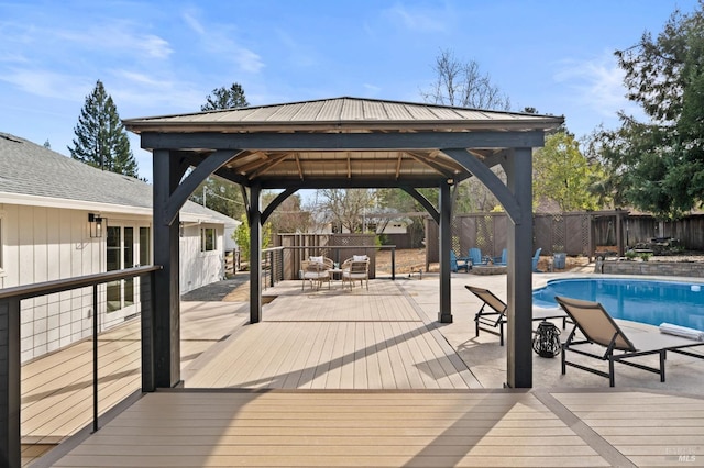 exterior space featuring a fenced in pool, fence, and a gazebo