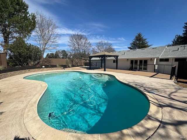 view of swimming pool featuring a fenced in pool, fence, a gazebo, and a patio