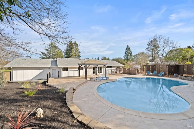 view of swimming pool with a patio, fence, a fenced in pool, and a gazebo