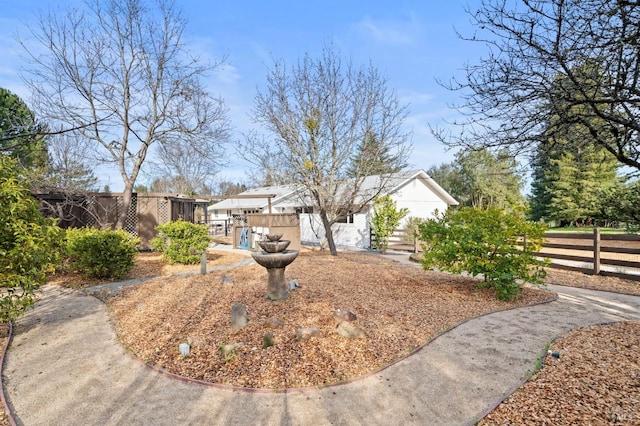 view of front of property featuring fence