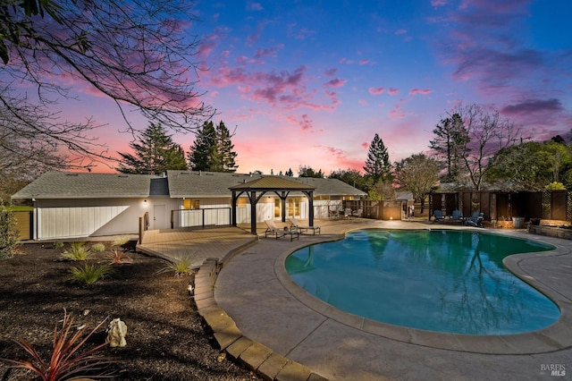 view of pool featuring a patio area, fence, a fenced in pool, and a gazebo