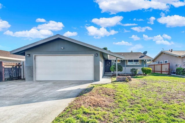 ranch-style house featuring a garage and a front lawn